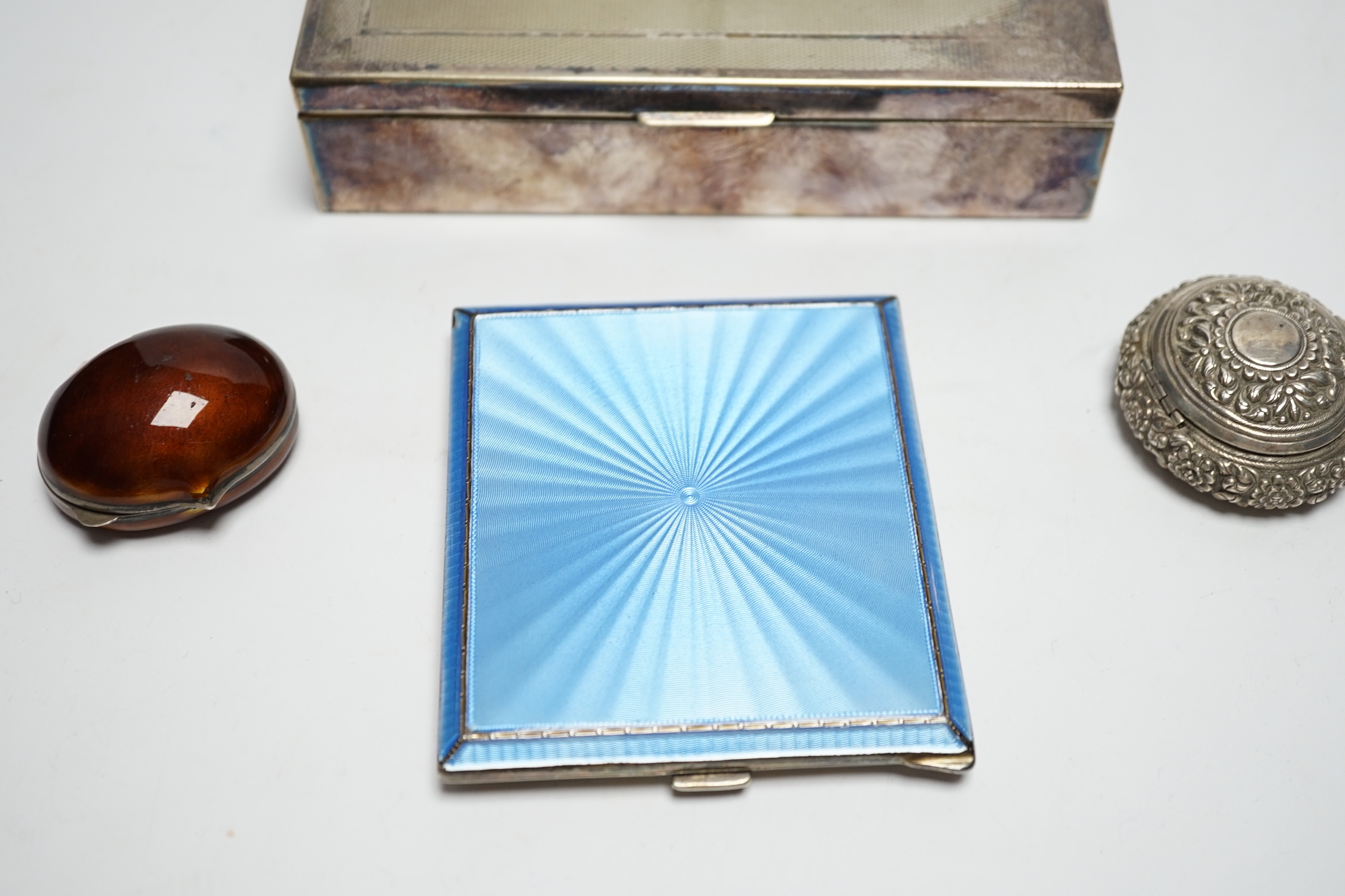 A George VI silver and guilloche enamel cigarette case, Birmingham, 1939, 93mm, a silver mounted cigarette box and two other small boxes including enamelled 'shell' box(a.f.).